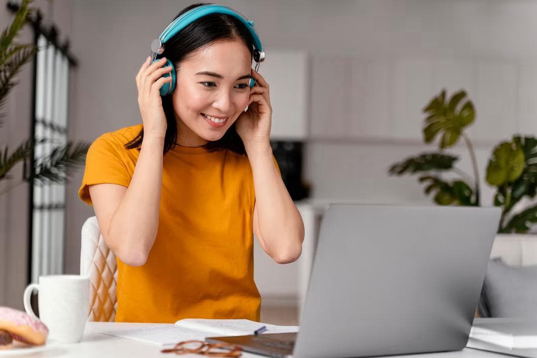 Person wearing headphones learning Polish
